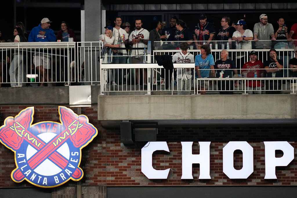 Fans watch a game between Chicago Cubs and Atlanta Braves from The Chop House above right field at Truist Park on Wednesday, Sept. 27, 2023, in Atlanta. (AP Photo/John Bazemore)