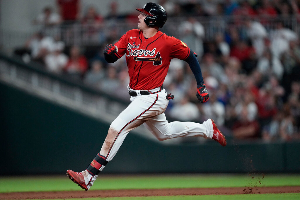 Atlanta Braves' Austin Riley runs to second base after hitting a double in the fifth inning against the Chicago Cubs, Thursday, Sept. 28, 2023, in Atlanta. (AP Photo/John Bazemore)
