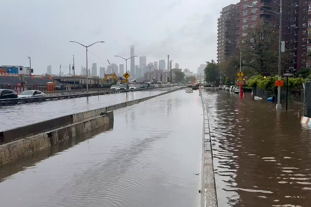 A section of FDR Drive sits submerged in flood waters, Friday, Sept. 29, 2023, in New York. (AP Photo/Jake Offenhartz)
