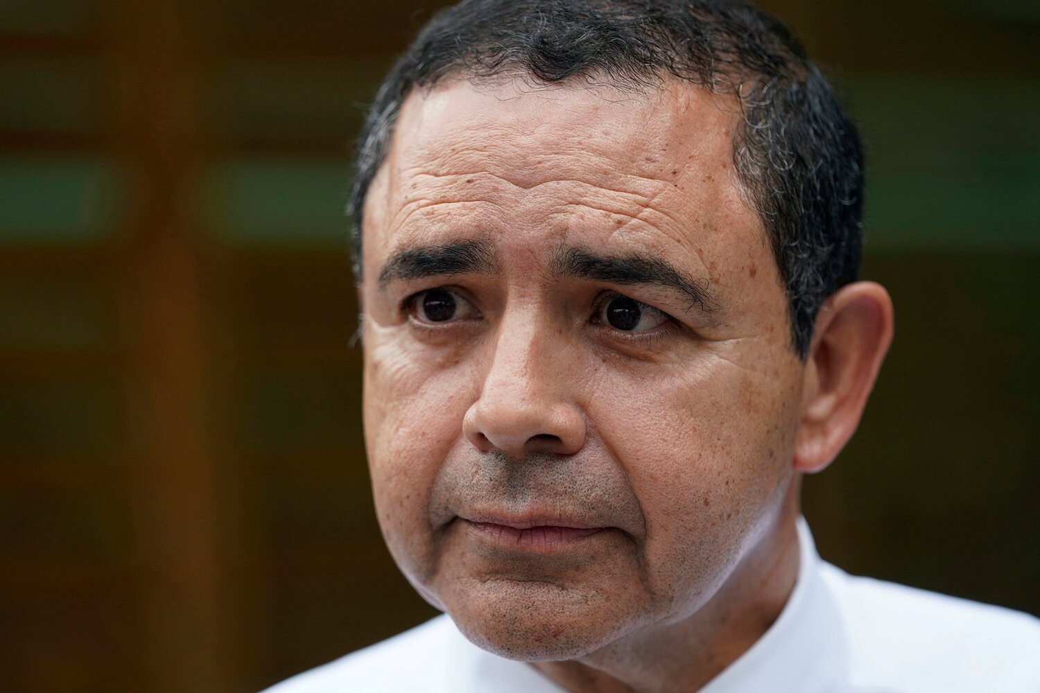 U.S. Rep. Henry Cuellar, D-Texas, talks to a member of the media during a campaign event in San Antonio, May 4, 2022. (AP Photo/Eric Gay, File)