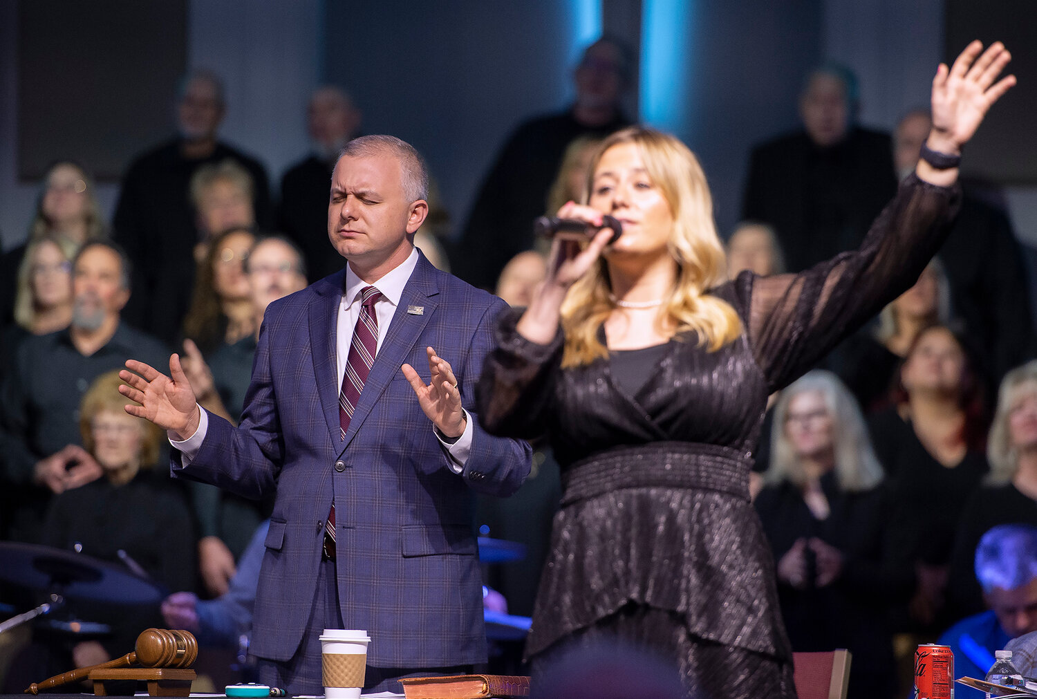 Georgia Baptist Convention President Josh Saefkow, left, and Kayla Smith worship during the third day of the Convention's 201st annual meeting at Church on Main in Snellville, Ga. (Index/Henry Durand)