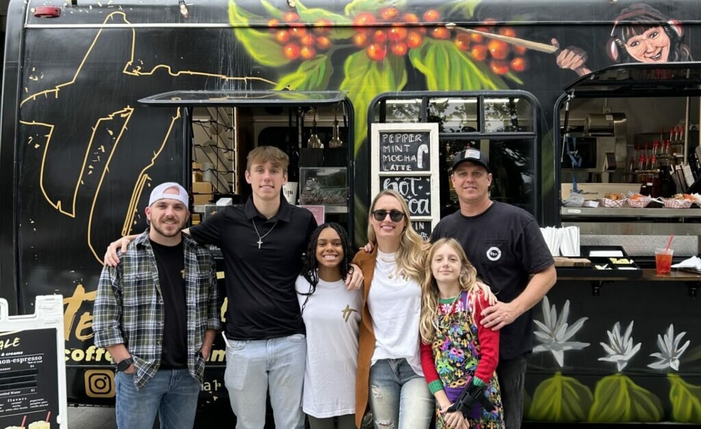 The Bookers stand in front of the Telltale Coffee & Creams mobile coffee shop. (Photo/Send Network)