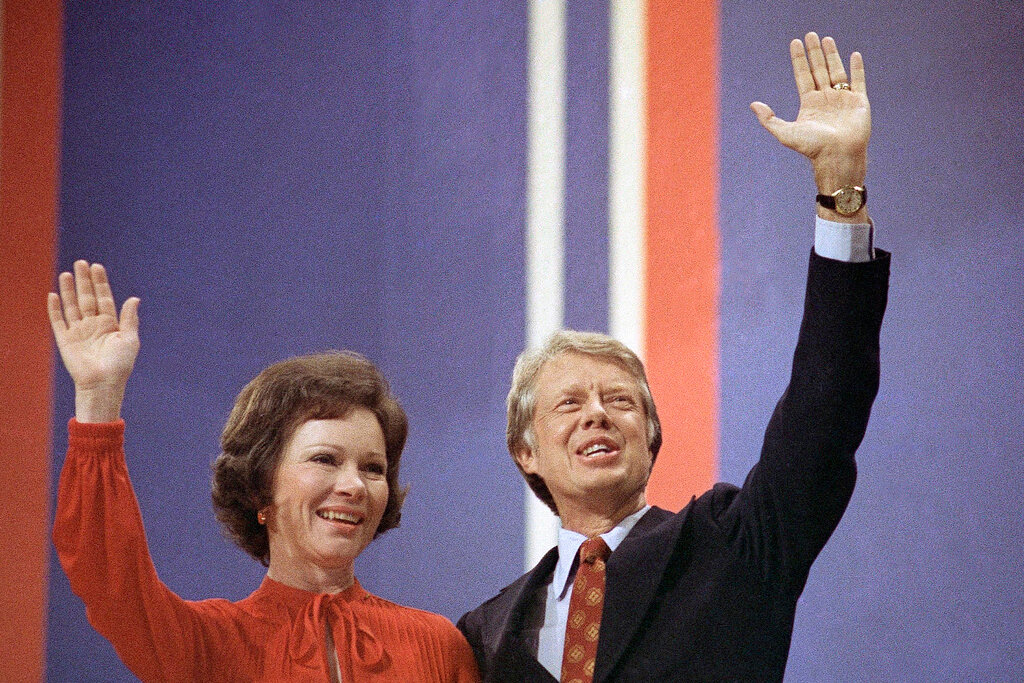 Jimmy Carter, right, and his wife, Rosalynn Carter, wave together at the National Convention in Madison Square Garden, July 15, 1976, in New York. Rosalynn Carter, the closest adviser to Jimmy Carter during his one term as U.S. president and their four decades thereafter as global humanitarians, died Sunday, Nov. 19, 2023. She was 96. (AP Photo, File)