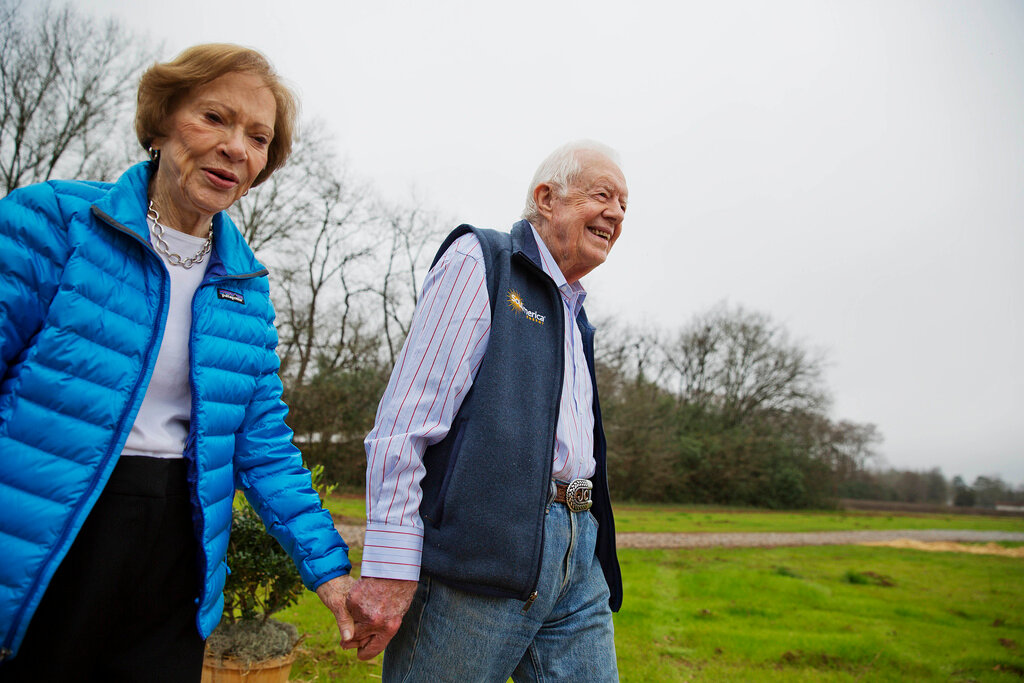 In this Feb. 8, 2017, file photo former President Jimmy Carter, right, and his wife Rosalynn arrive for a ribbon cutting ceremony for a solar panel project on farmland he owns in their hometown of Plains, Ga  Jimmy and Rosalynn Carter have been best friends and life mates for nearly 80 years. Now with the former first lady's death at age 96, the former president must adjust to life without the woman who he credits as his equal partner in everything he accomplished in politics and as a global humanitarian after their White House years.(AP Photo/David Goldman, File)