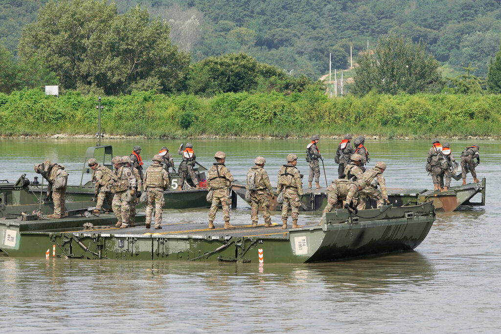 U.S. and South Korean soldiers try to connect a floating bridge during the Ulchi Freedom Shield military exercise in Cheorwon, South Korea, on Aug. 31, 2023. (AP Photo/Lee Jin-man)
