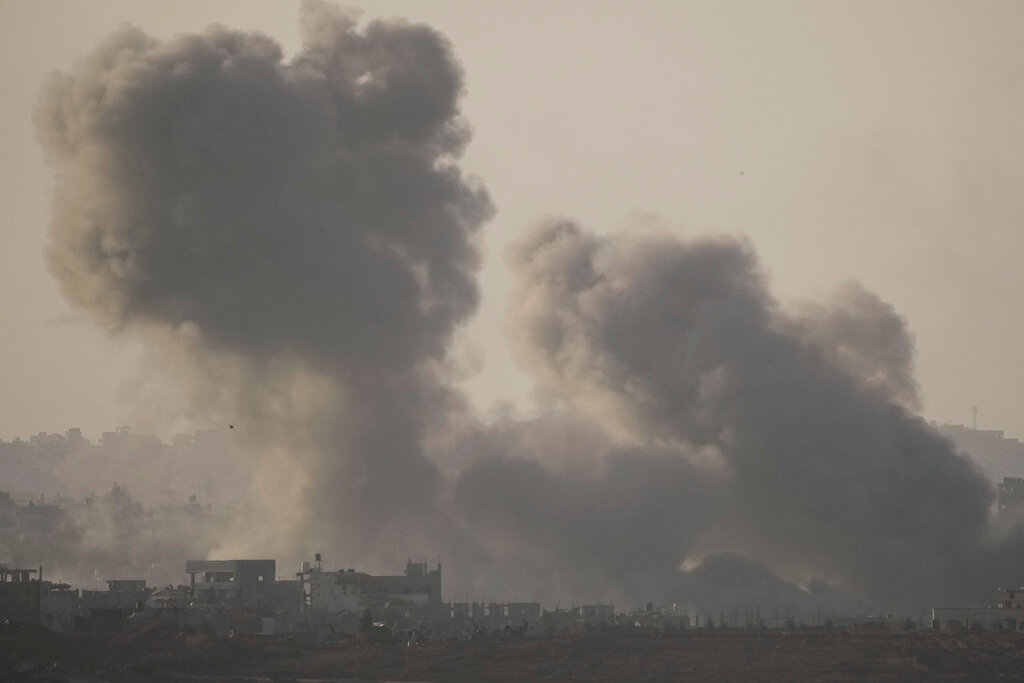Smoke rises following an Israeli bombardment in the Gaza Strip, as seen from southern Israel, Saturday, Dec. 2, 2023. (AP Photo/Leo Correa)