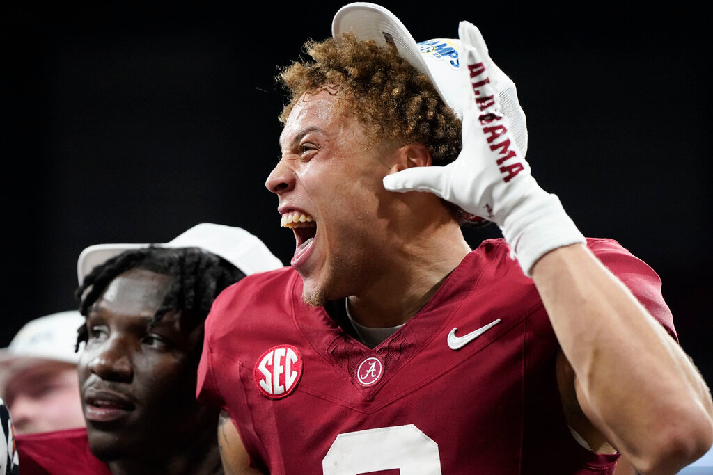 Alabama wide receiver Jermaine Burton celebrates after beating Georgia in the Southeastern Conference championship game in Atlanta, Saturday, Dec. 2, 2023. (AP Photo/Mike Stewart)