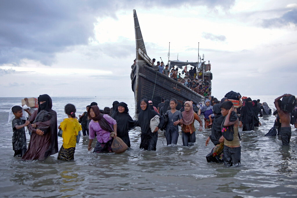 Ethnic Rohingya disembark from their boat upon landing on a beach in Ulee Madon, North Aceh, Thursday, Nov. 16, 2023. (AP Photo/Rahmat Mirza, File)
