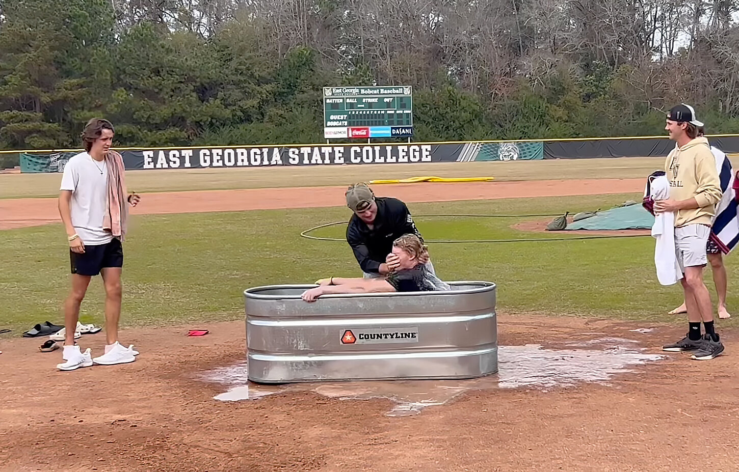Robbie Lane, the starting shortstop on the East Georgia State College baseball team and an aspiring minister, baptizes one of his teammates on Friday, December 1, in Swainsboro, Ga.