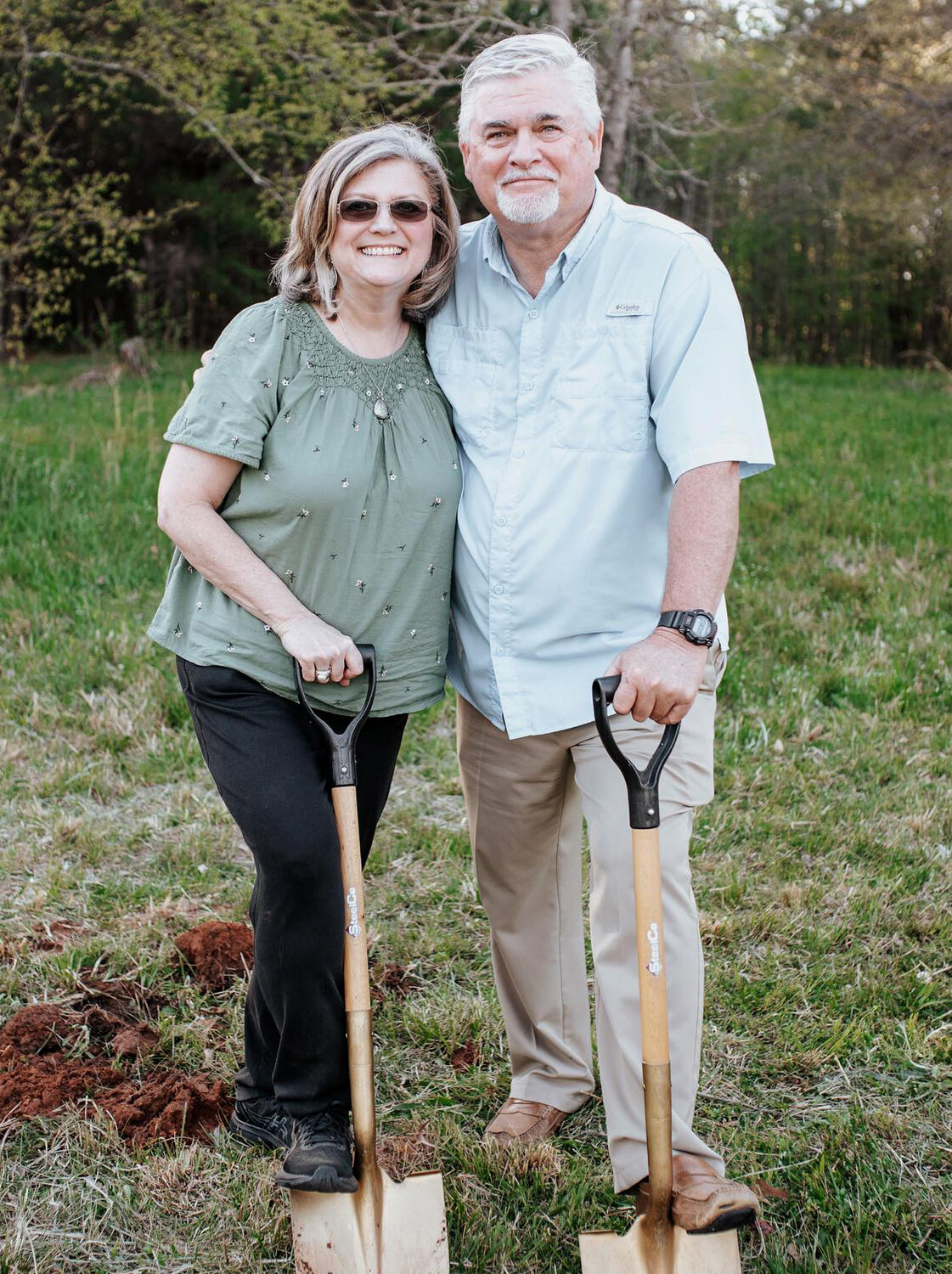 Mike and Angie Peavy participate in the groundbreaking ceremony for Gratis Church. (Photo/Gratis Church)