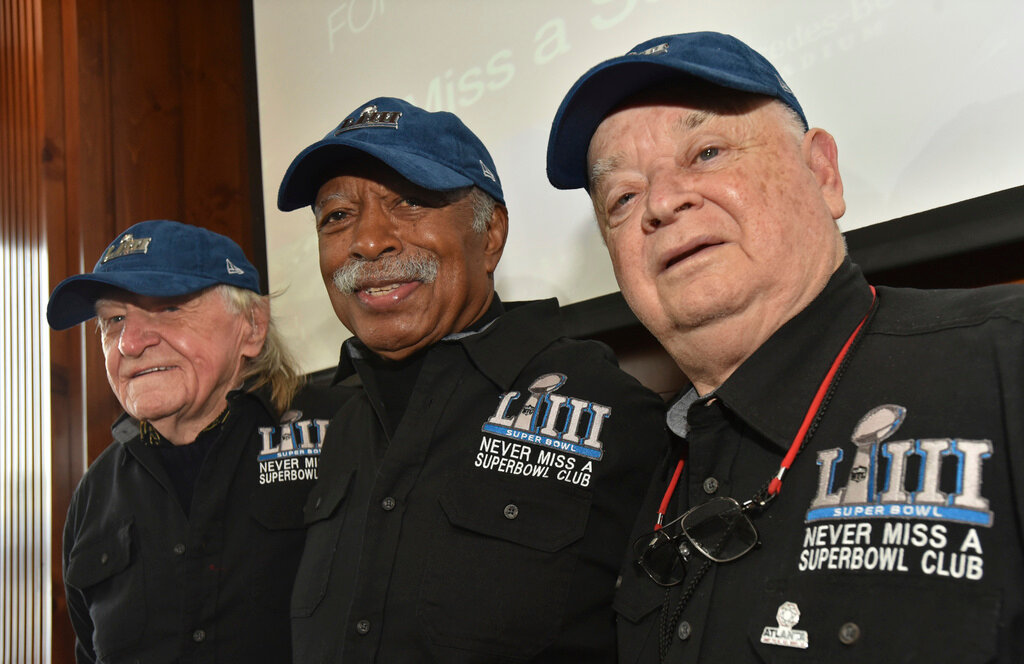 Members of the Never Miss a Super Bowl Club, from left, Tom Henschel, Gregory Eaton, and Don Crisman pose for a group photograph during a welcome luncheon, in Atlanta, Friday, Feb. 1, 2019.  (Hyosub Shin/Atlanta Journal-Constitution via AP, File)