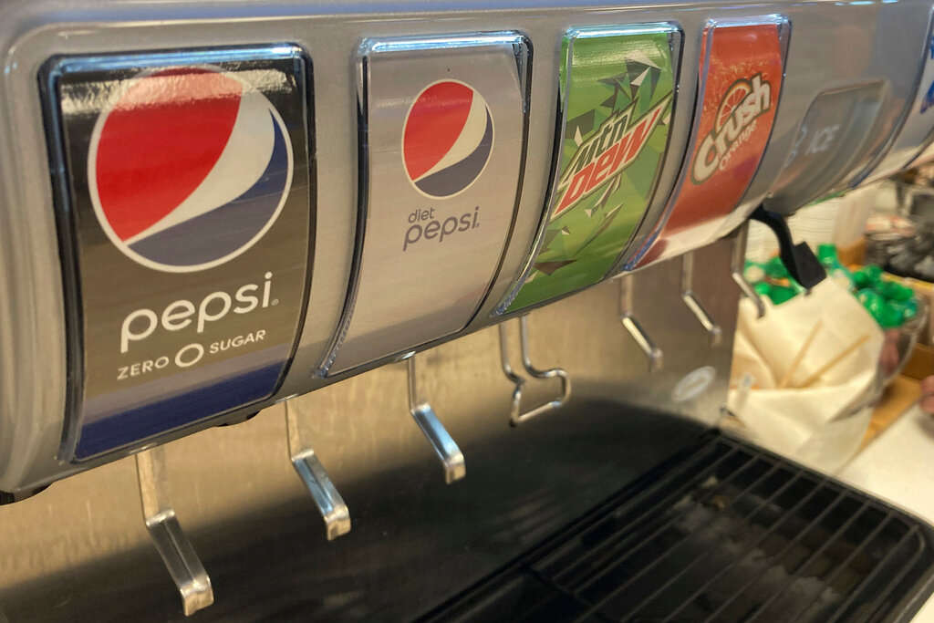 A soda dispenser machine features Pepsi products March 27, 2022, in Miami Gardens, Fla. (AP Photo/Wilfredo Lee)