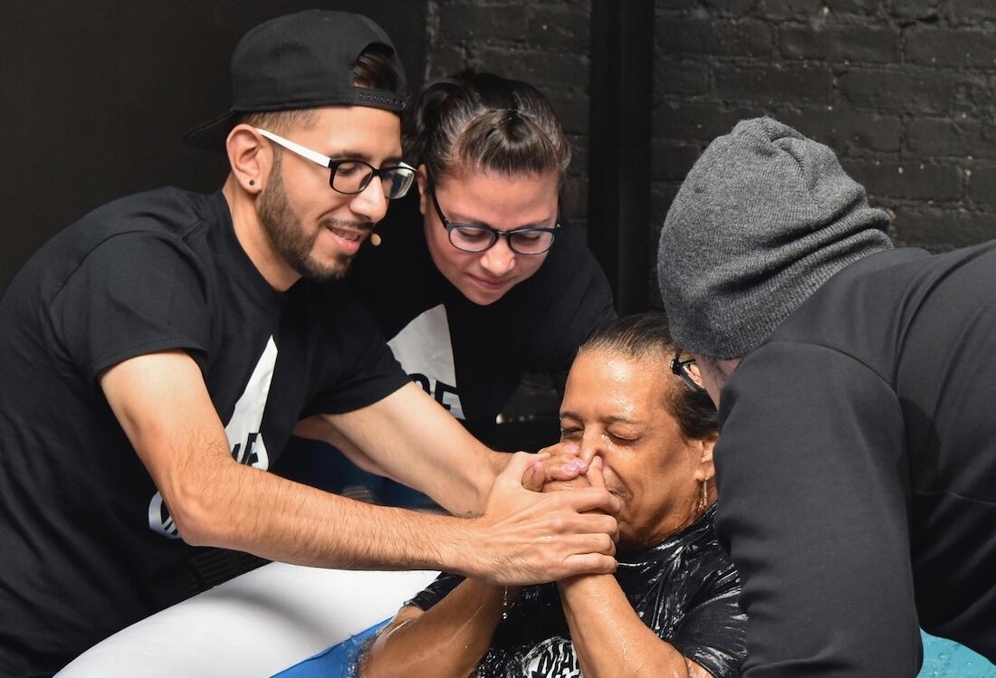 Danny Torres, who was born and raised in the Bushwick neighborhood of Brooklyn, N.Y., baptizes a new believer. (Photo/Swerve Church)