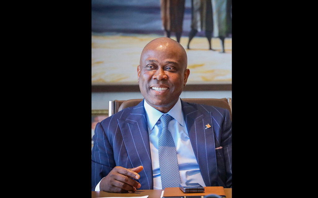 This undated photograph shows Herbert Wigwe, chief executive of Access Bank, Nigeria in his Lagos office. Wigwe was killed Friday, Feb. 9, 2024 along with his wife and son when a helicopter they were riding in crashed near in Southern California's Mojave Desert. (AP Photo/Ayodeji Owolabi)