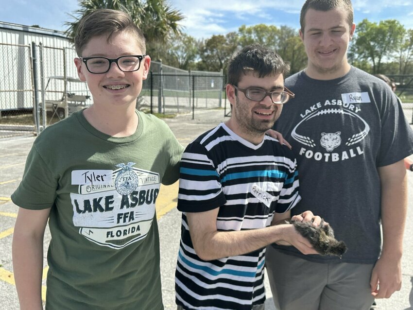 Tyler Brock, is joined by his Poultry Pal, Patrick, and another Buddy, Ryan, from Lake Asbury Junior High.