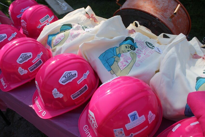 From the early-morning hours through the mid afternoon’s blazing heat, all the women donned bright pink T-Shirts and hard hats.