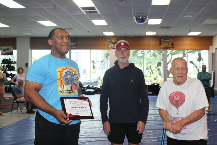 The group presented martial arts instructor James Smiley with a plaque of recognition at their last session on Sunday, June 1.