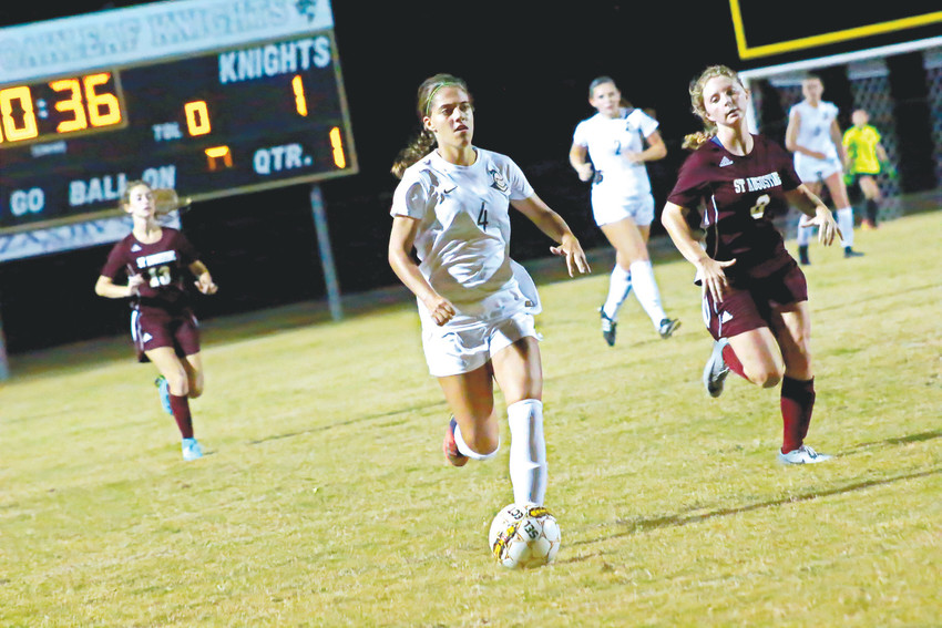 Oakleaf High soccer forward Michelle &ldquo;K-Smash-Ski&rdquo; Kanaski flies downfield en route to one of her three goals for Lady Knights in 9-1 season opening district win over St. Augustine.