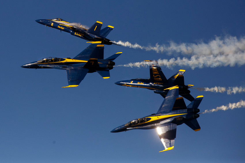 The Blue Angels diamond formation performs a version of the groups fleur de lis maneuver at Naval Air Station Jacksonville during the base's annual air show.