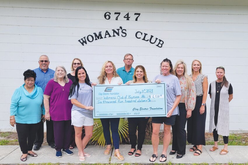 From left, Junior Woman&rsquo;s Club members Maria Walker, Tina Bullock, Tori Hersey, Amy Webber, Brooklyn Hayes-Yelin, Dana Eatmon, Cindy Loose, Kim Dyal and Karan Lake were thrilled to get the donation from Clay Electric.