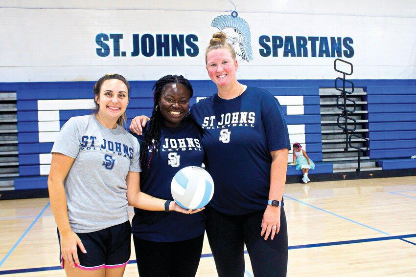 St. Johns Country Day School&rsquo;s first scholarship volleyball athlete, Jenna Williams, left, stands with her new assistant coaches, from left, former Ridgeview High and Erskine College standout Jauhna Smith and former St. Johns Country Day School and University of Miami standout Madison Dill-McDermott.