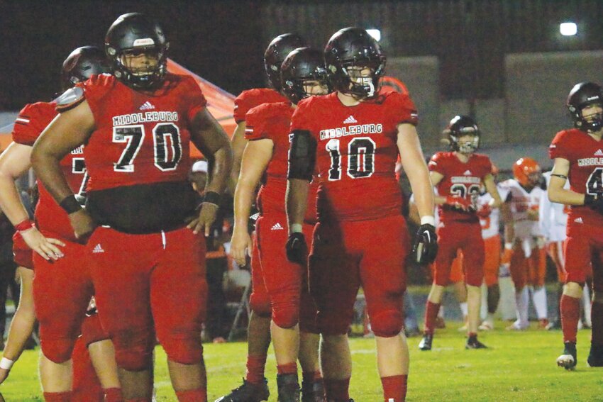 Middleburg High&rsquo;s massive offensive line is led by tackle Micah George, No. 70, here with graduated fullback Wyatt Underwood in last year&rsquo;s historic playoff run for coach Ryan Wolfe.