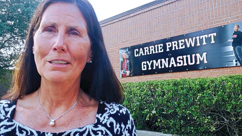 Retired Middleburg High girls volleyball coach Carrie Prewitt returned to her home gym after a 30-year career to be celebrated with the naming of the gym with her name. Prewitt, a 30-plus year coach for the Lady Broncos, was on hand for the Middleburg vs. Fleming Island home game.