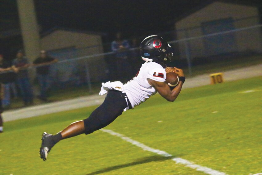 Middleburg High wide receiver Jaydan Jenkins lets fly to catch 40-yard pass from Bronco quarterback Carson Stewart in first-half action of Bronco's 36-0 district win over Ridgeview.