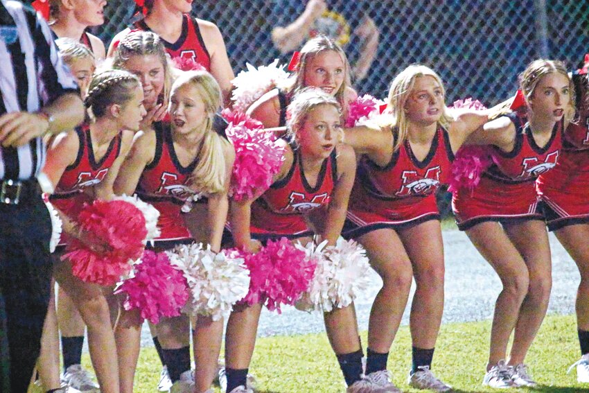 Middleburg High cheerleaders stay poised as the Broncos football team attempts to score while on the Clay 10-yard line in the second half of the Broncos&rsquo; 35-33 win Friday night.