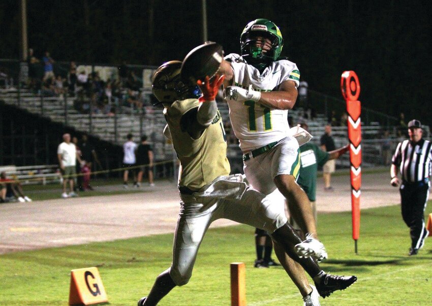 Fleming Island wide receiver Devaen Boykin battles with Lake Minneola defender Jonah Cali in end zone in Golden Eagles 56-20 loss on Friday. Lake Minneola was a region finalist last year losing to 4S champion Lakeland.