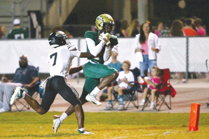 Fleming Island wide receiver Kaylib Singleton high steps into end zone after catching pass from quarterback Cibastian Broughton in Golden Eagles district loss to Buchholz.