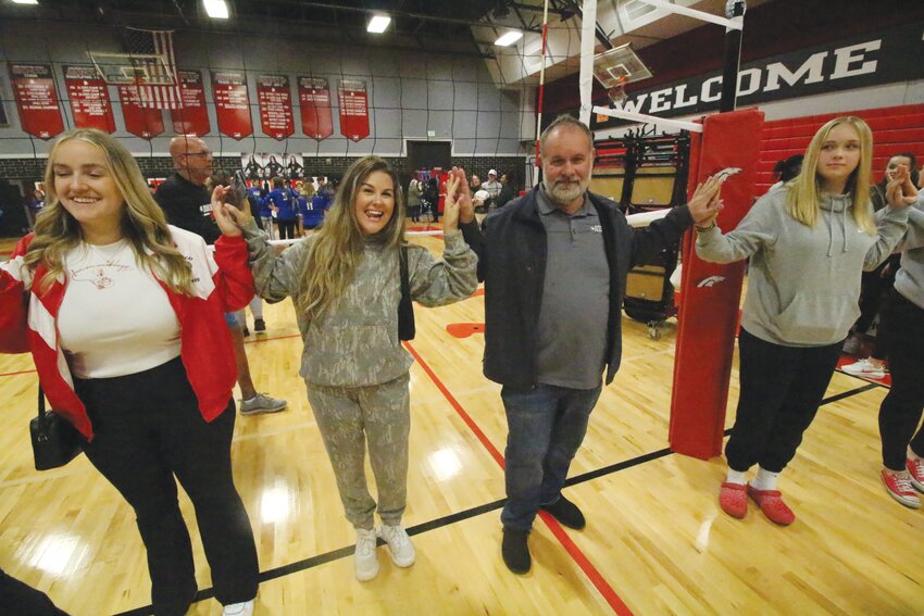 Long-time Middleburg High volleyball coach Tony Valentin celebrates their 2023 Final Four berth with daughter Kasey Valentin who was part of the 2013 and 2014 Final Four Broncos teams under coach Carrie Prewitt.
