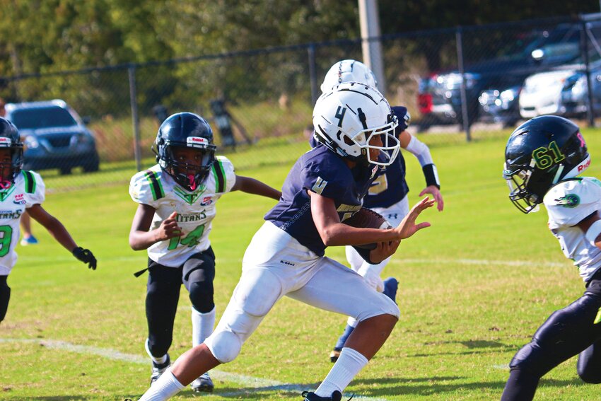 Fleming Island Dreadnaughts 11-under running back Patric Chaney high-steps into the line of scrimmage en route to a touchdown in a 38-6 playoff win over Titletown Titans as Dreadnaughts advance to division championship at Lake Mary High on Saturday with a shot at Pop Warner National Title in two weeks.