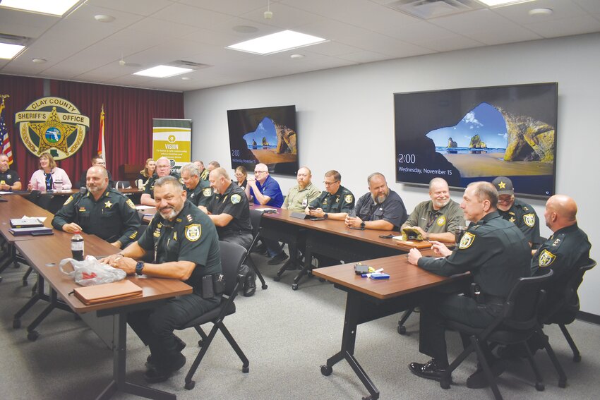 Sheriff Michelle Cook and Clay County Sheriff’s Office Lt. Mike Lane map out strategies to staff five parades, three special events and a circus at the Orange Park Mall – all on Dec. 9.