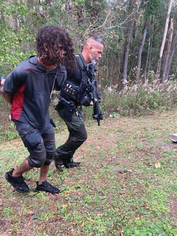 A suspect wanted by the Jacksonville Sheriff&rsquo;s Office for carjacking was tracked to Blanding Boulevard near Henley Road Sunday, triggering a two-hour manhunt that ended with deputies overwhelming him while he hid in Little Black Creek near County Road 220.