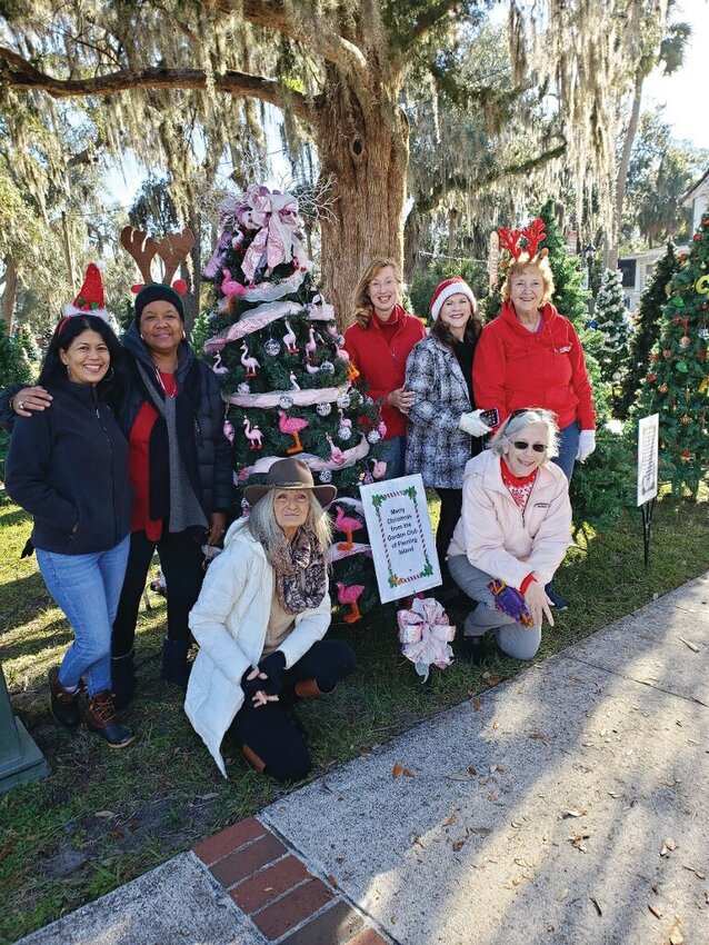 Members of the Fleming Island Garden Club admire their decorated tree at the Parade of Trees in Green Cove Springs&rsquo; Spring Park.