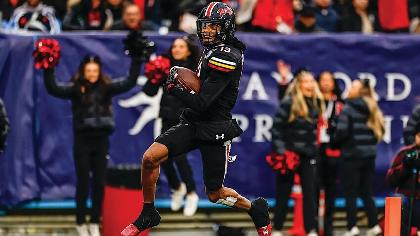 Former Ridgeview High football standout Glendon Miller heads to the end zone with a third-quarter interception against Auburn in Maryland's 31-13 win in the TransPerfect Music City Bowl in Nashville.