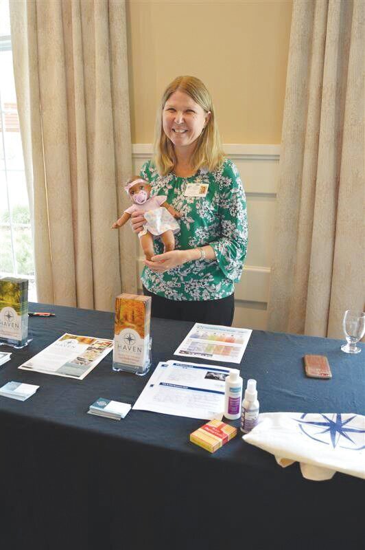 Haven Hospice Dementia Care program manager Anita Howard displays some of the resources provided by the program, including enrichment tools and educational materials for caregivers. The Plein Foundation awarded Haven with a $25,000 grant.