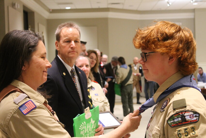 The newly honored Eagle Scouts are awarded new scout handkerchiefs and letters of accolades from state officials, county officials and community leaders.