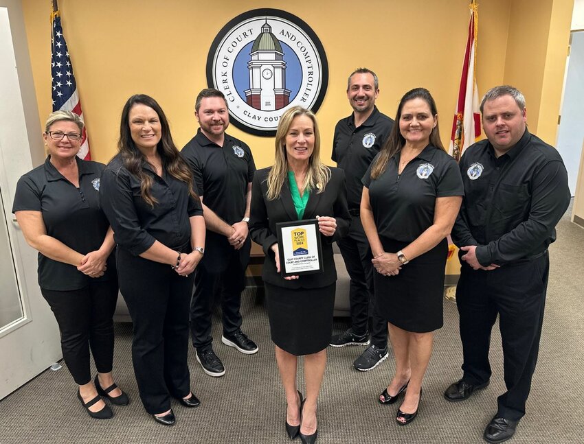 Clerk of County Court and Comptroller Tara S. Green is surrounded by members of her staff after being recognized as one of the Top Workplaces of 2024.