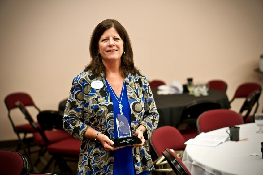 Katie Vineyard accepted the Paul E. Reinhold Community Service Award in 2018 after Challenge Enterprises was selected as the top nonprofit in Clay County.