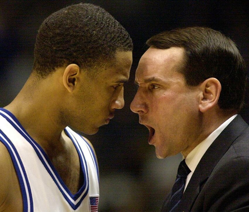 Duke's Dahntay Jones gets an up-close and personal earful from head coach Mike Krzyzewski after he committed a foul with less than one second remaining against Kentucky.