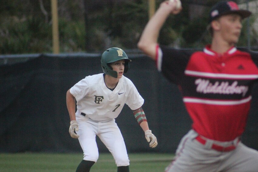 Fleming Island baserunner Tanner Upton eyes a pitch by Middleburg pitcher Maddox Lee in 6-0 win by Golden Eagles on Monday