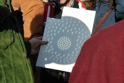 You can view the solar eclipse by making a pinhole viewer and keeping the Sun at your back.