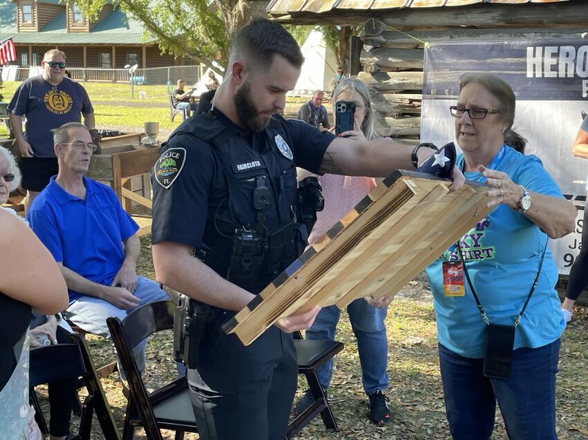 Orange Park Police Officer Doug Faircloth received the Hero of the Day honor from Clay County Agricultural Fair Office Manager Karen Brown on Thursday, April 4. Officer Faircloth saved a child from drowning in the St. Johns River.