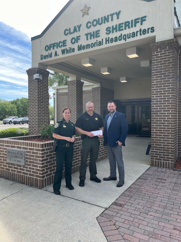 From left, CCSO Chief Billy Arnold, brother of Terry Arnold, accepted the donation from the Signal 35 Fund's Sheriff Michelle Cook and Signal 35 Fund board member Judson Sapp.