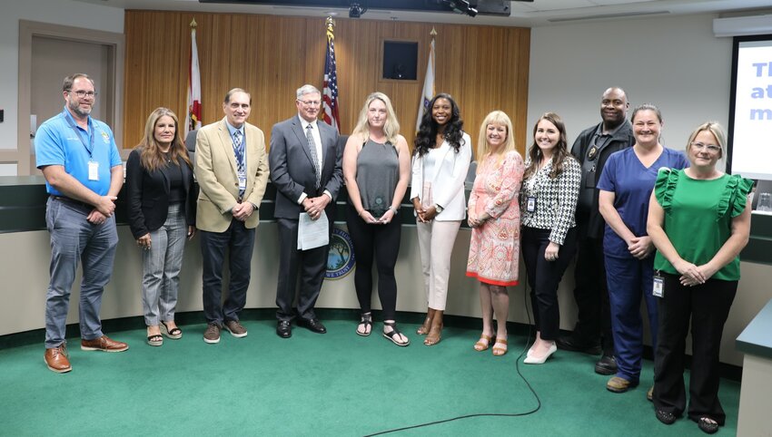 Clay County Animal Control Volunteer Amie Hagar, center, was recognized Tuesday by the Board of County Commission as the first Volunteer of the Year.