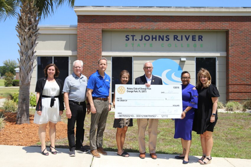 In photo: From left, Michele Riley, Doug Fuzzell, Jack Scorby, Gi Teevan, President Joe Pickens, Dr. Iana Harris and Michelle Sjogren commemorate the collaboration between Rotary Club of Orange Park at St. Johns River State College Foundation&rsquo;s Random Act of Kindness.
