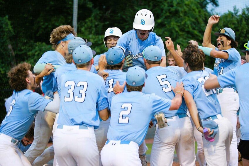 The Spartans celebrate the game-winning home run Tuesday that will send the team to the FHSAA Final Four on Monday at 10 a.m. against St. Petersburg Northside Christian.