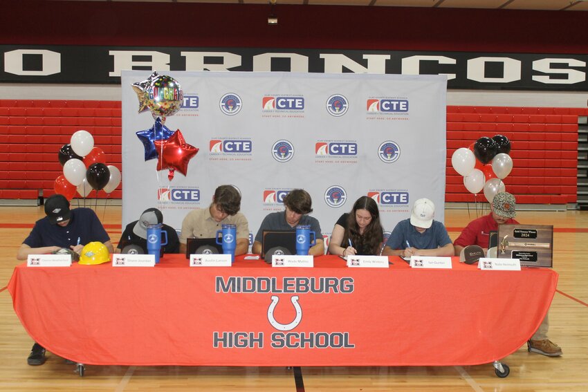 Seven students at Trades Signing Day signed letters of intent, symbolizing their commitment to entering the workforce in their chosen trade.